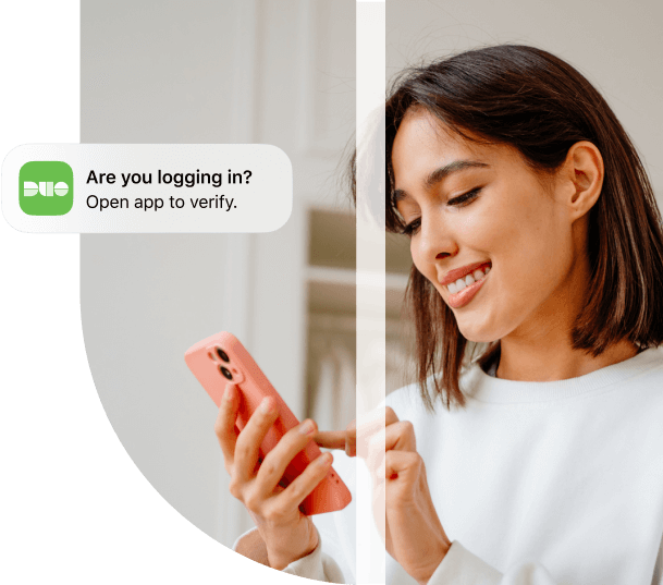 Person logging in on a mobile device using Duo MFA.